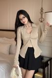 Set áo thun kiểu xoắn ngực tay dài phối chân váy mini xếp ly