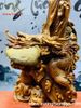 Đạt Ma đứng rồng ôm đá gỗ hương.