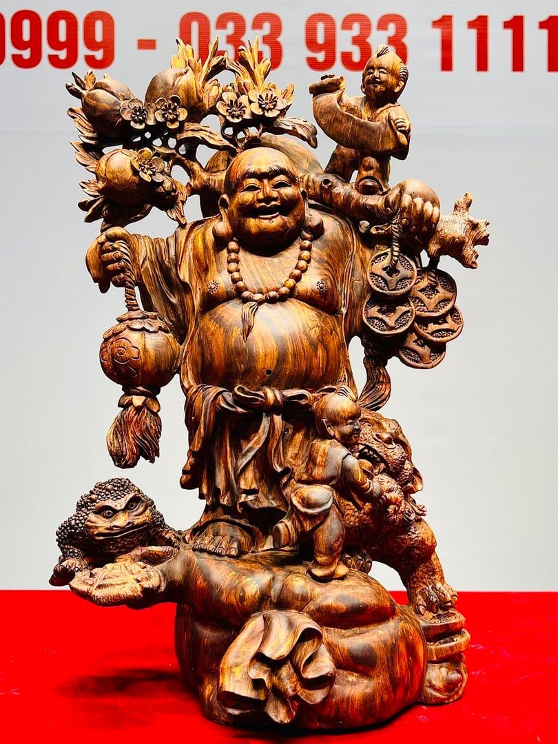 Di Lạc Nhị Tiểu Vác Cành Đào Đứng Bao Tiền Gỗ Sưa