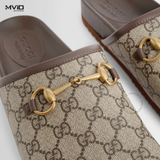  SLIPPER GUCCI NÂU LOGO GG CANVAS KHÓA GOLD 749908 