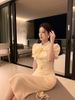 Đầm Kem Nơ Nút Vàng To