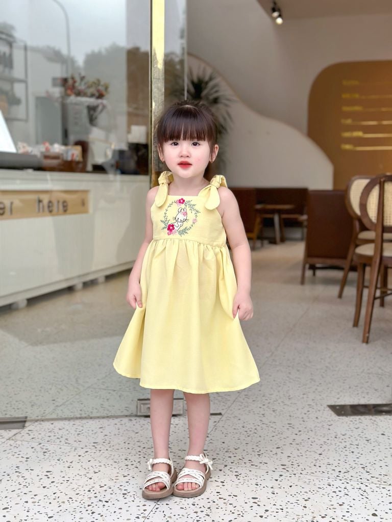  Đầm nơ vai thêu thỏ - Vàng 