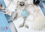  Vòng cặp đá Mắt Bão mix Aquamarine và Charm Bạc 