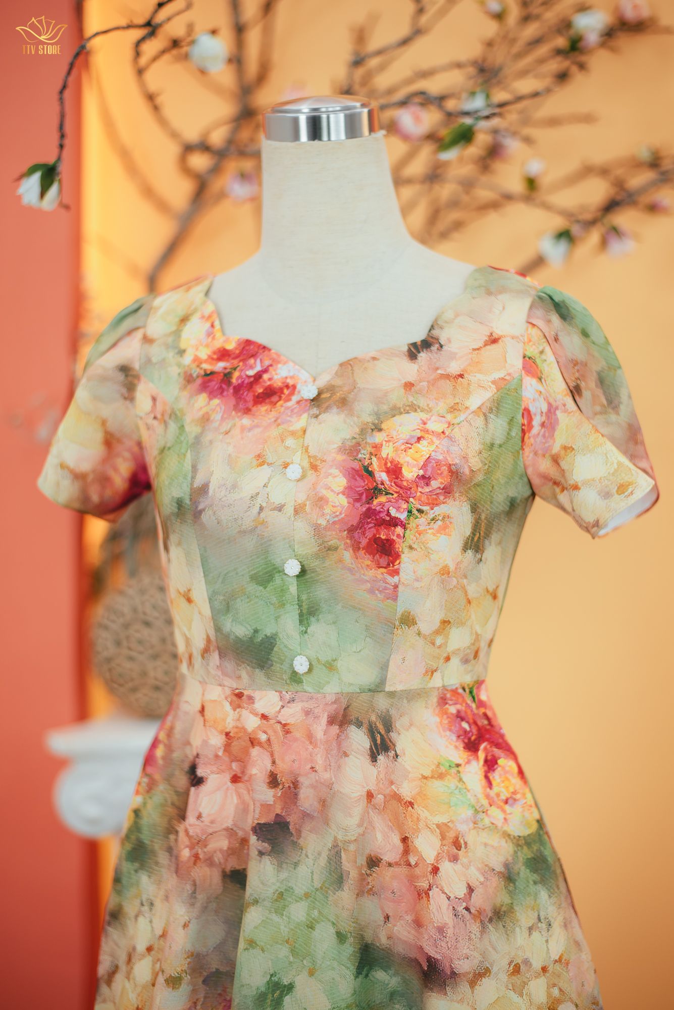 Đầm xòe - Cổ tim sóng nước kết nút tay búp - CT - Xanh cam họa tiết - TTV1714