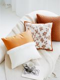 Gối vải da kết hợp cam trắng chi tiết nhấn bông