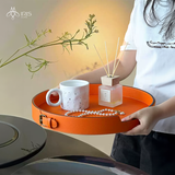 Khay đựng tròn cam bằng da PU chi tiết đai trên viền khay