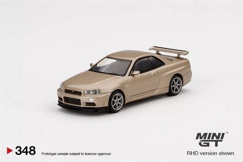  Mô hình xe Nissan Skyline GT-R (R34) M-Spec Silica Breath Gold tỉ lệ 1:64 MiniGT MGT00348 