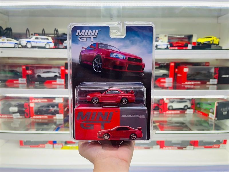  Mô hình xe Nissan Skyline GT-R (R34) V-Spec Active Red tỉ lệ 1:64 MiniGT bản card MGT00796-BL 