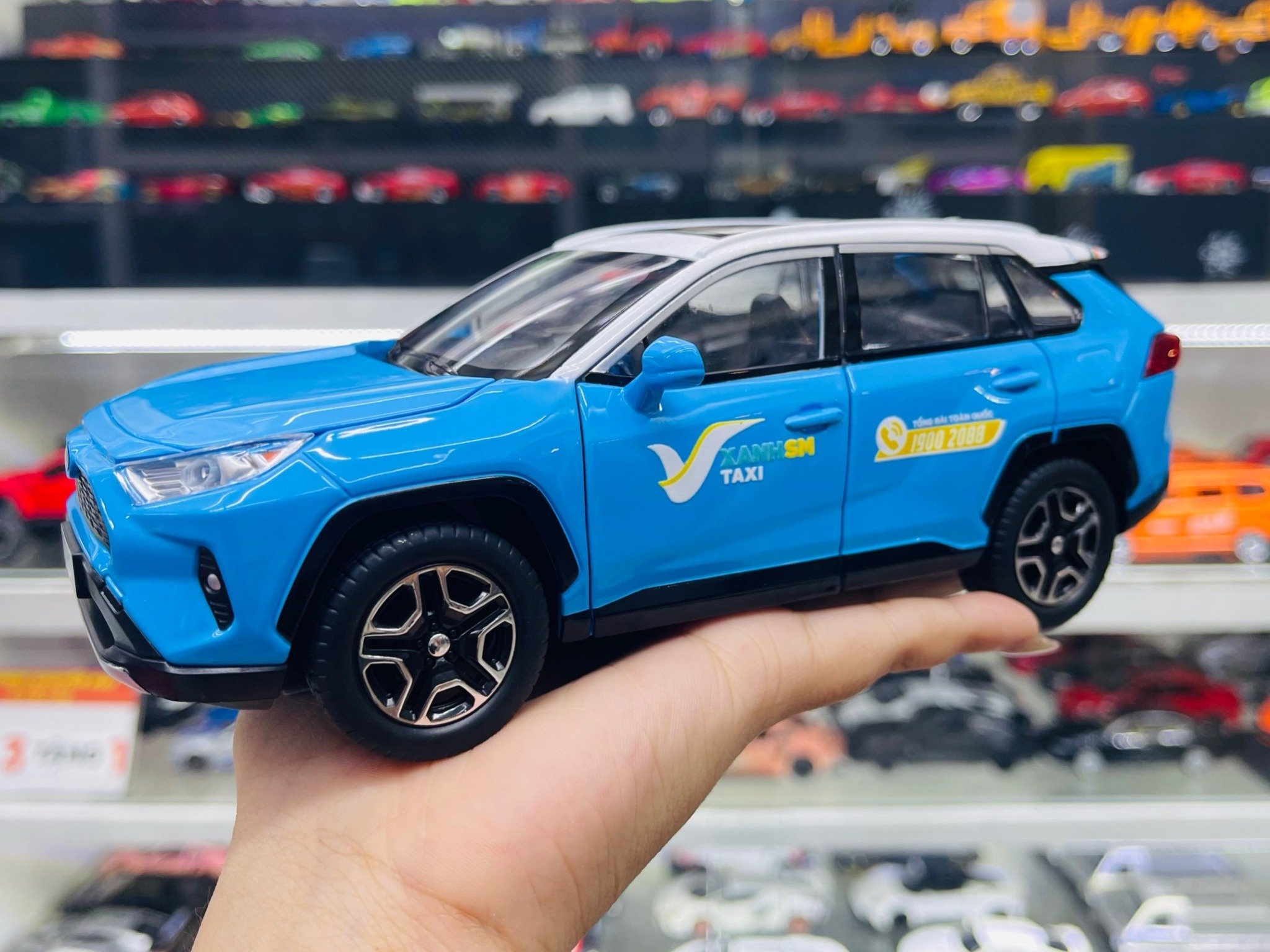  Mô hình xe độ dịch vụ taxi Toyota RAV4 tem xanh SM tỉ lệ 1:24 Alloy Autono1 OT546 
