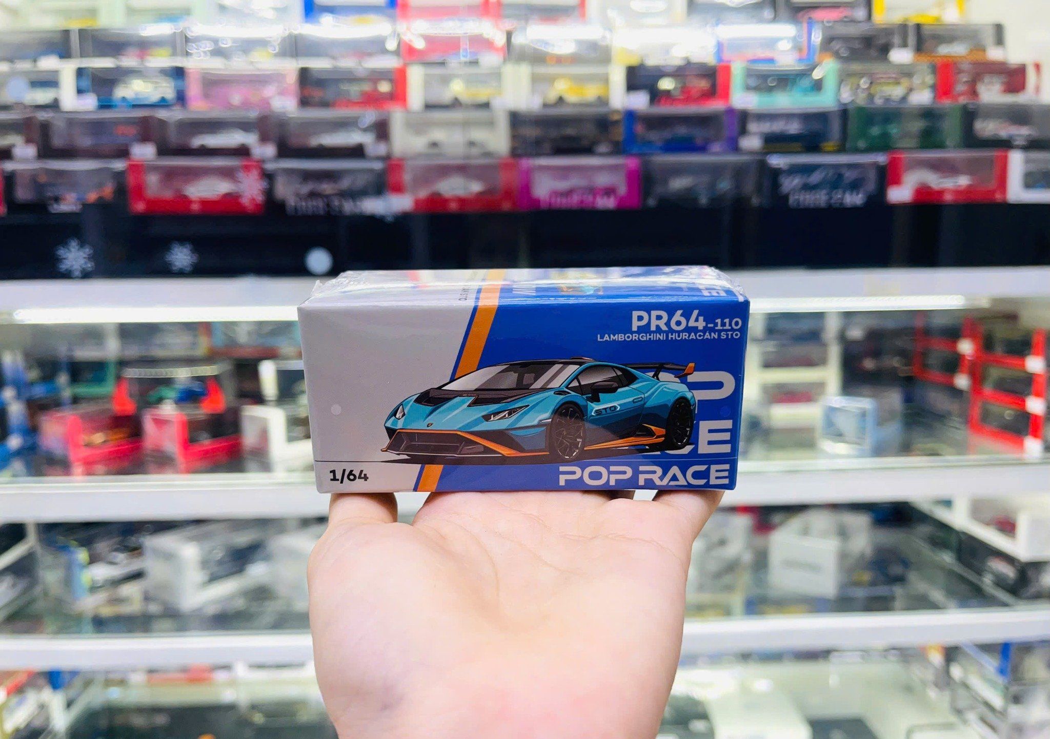  Mô hình xe Lamborghini Huracan STO Blu Laufey Arancio Xanto tỉ lệ 1:64 Poprace PR640110 