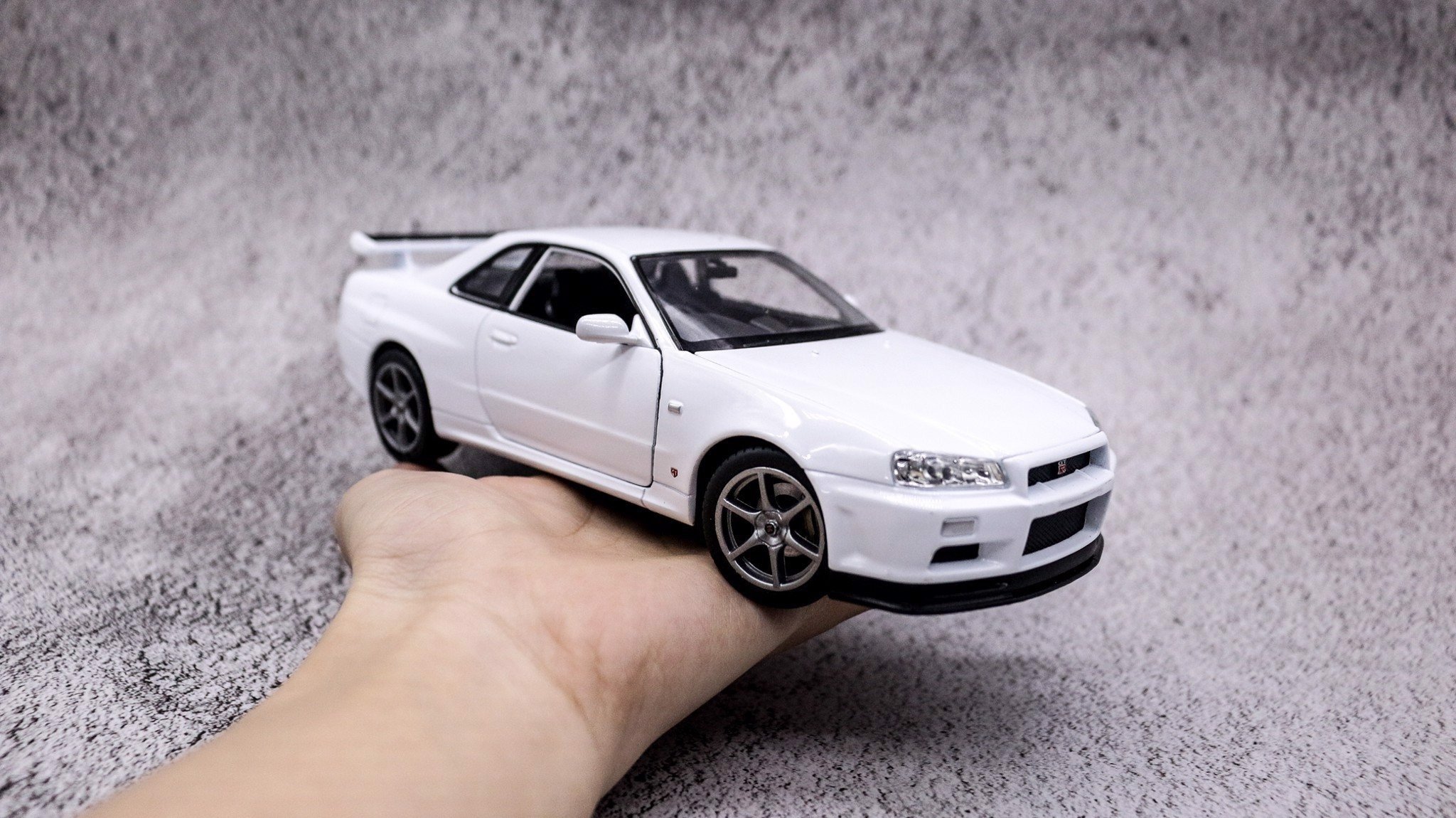  Mô hình xe Nissan Skyline Gt-R R34 có bản quyền 1:24 Welly OT132 
