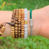  Vòng tay Tibet bện chỉ xanh rêu xám mix charm Ống trụ khắc chú Om Mani Padme Hum bình an may mắn 