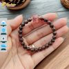Vòng tay hạt gỗ trầm hương tốc vườn size 6 li mix cỏ 4 lá đá thạch anh tóc đỏ may mắn bình an