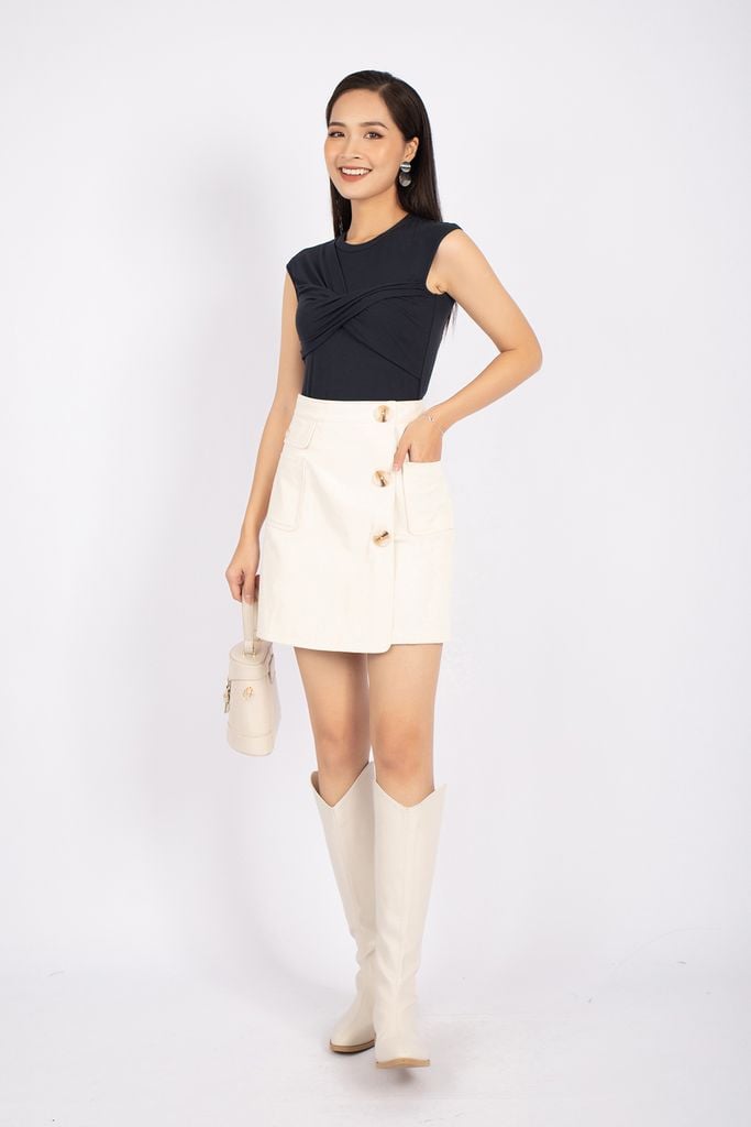 FJN7643 - Chân váy midi vải thô dáng A vạt lệch phối khuy và túi hai bên hông trang trí - PANTIO
