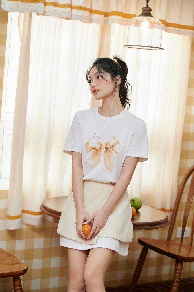 FQN3390 - Chân váy ngắn dáng suông vạt lệch phối khuy kim loại tạo kiểu - JAN.