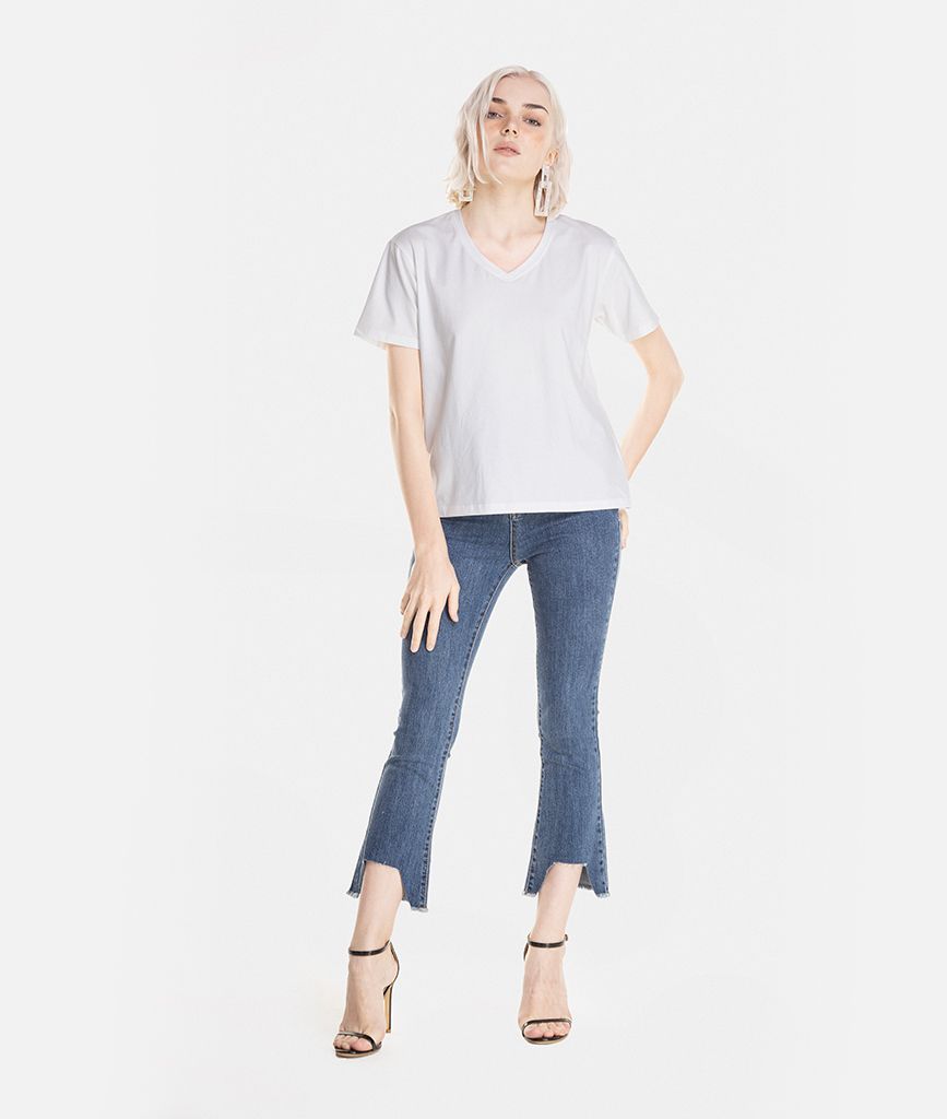 Quần denim dài lai xéo