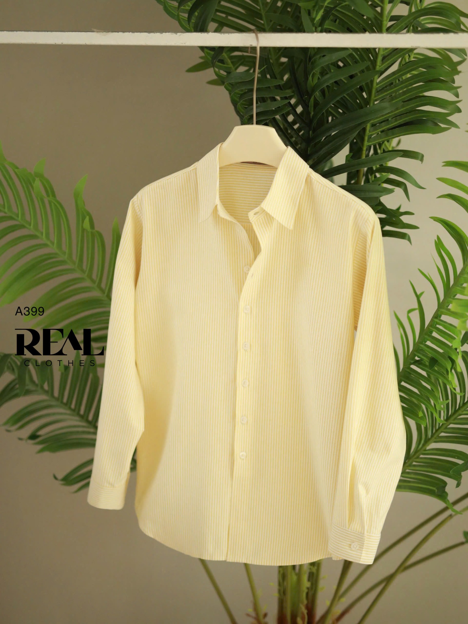 Sơ mi form rộng sọc vàng