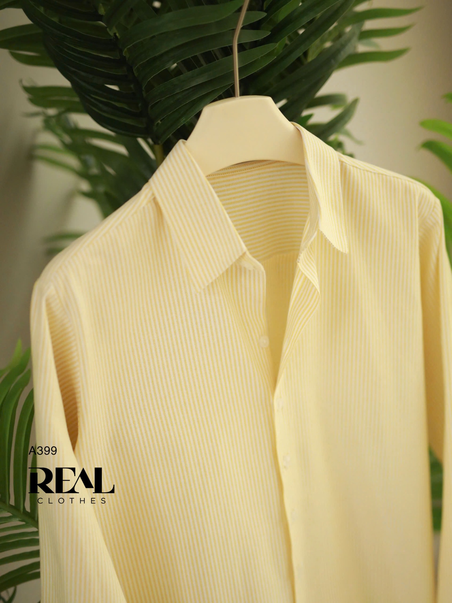 Sơ mi form rộng sọc vàng