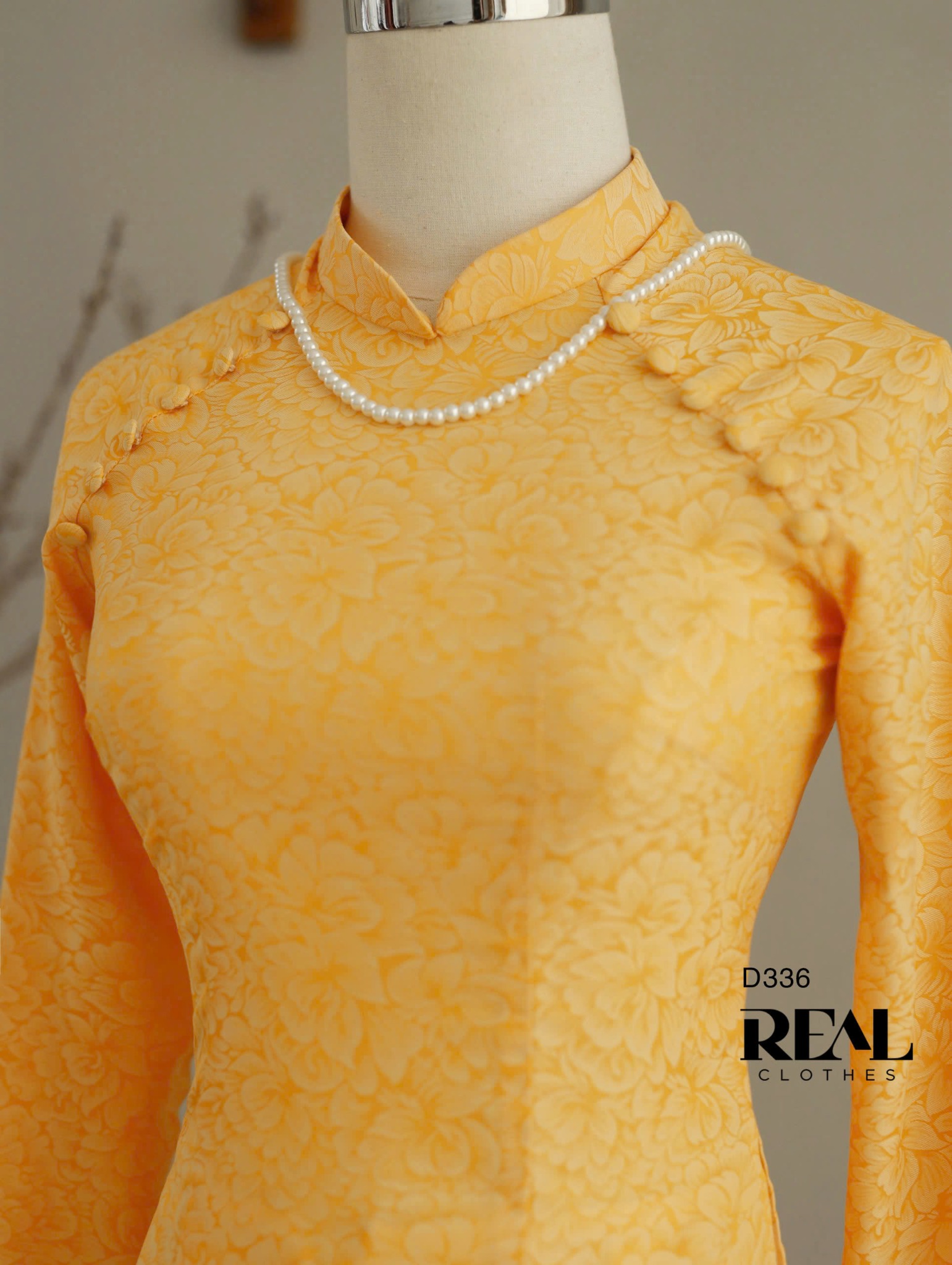 Áo dài truyền thống nhã an vàng tay dài