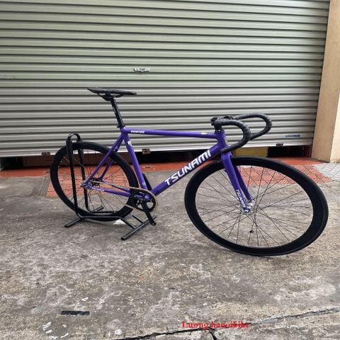 Xe đạp Fixed gear Tsunami SNM100 Tím cơ bản tay cong