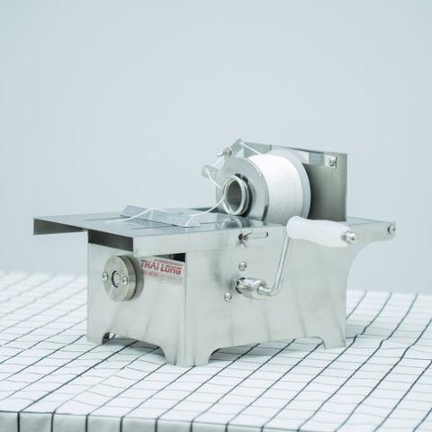 Máy buộc chỉ xúc xích quay tay