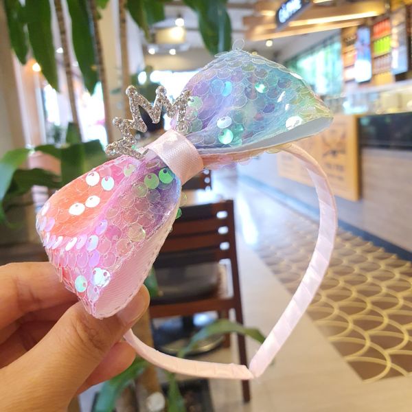  Cài tóc vương miện nơ kim sa cầu vồng lung linh cho bé 