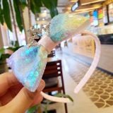  Cài tóc vương miện nơ kim sa cầu vồng lung linh cho bé 