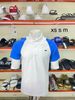 Áo Polo Lacoste Trắng Tay Xanh Cam - New - DH5042 00 9TG