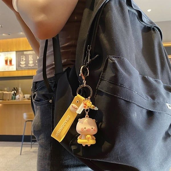  Móc khoá heo béo ôm phao 