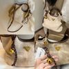 Túi Chio2nd da lộn màu kem viền nâu kèm charm lục lạc 26cm