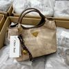 Túi Chio2nd da lộn màu kem viền nâu kèm charm lục lạc 26cm