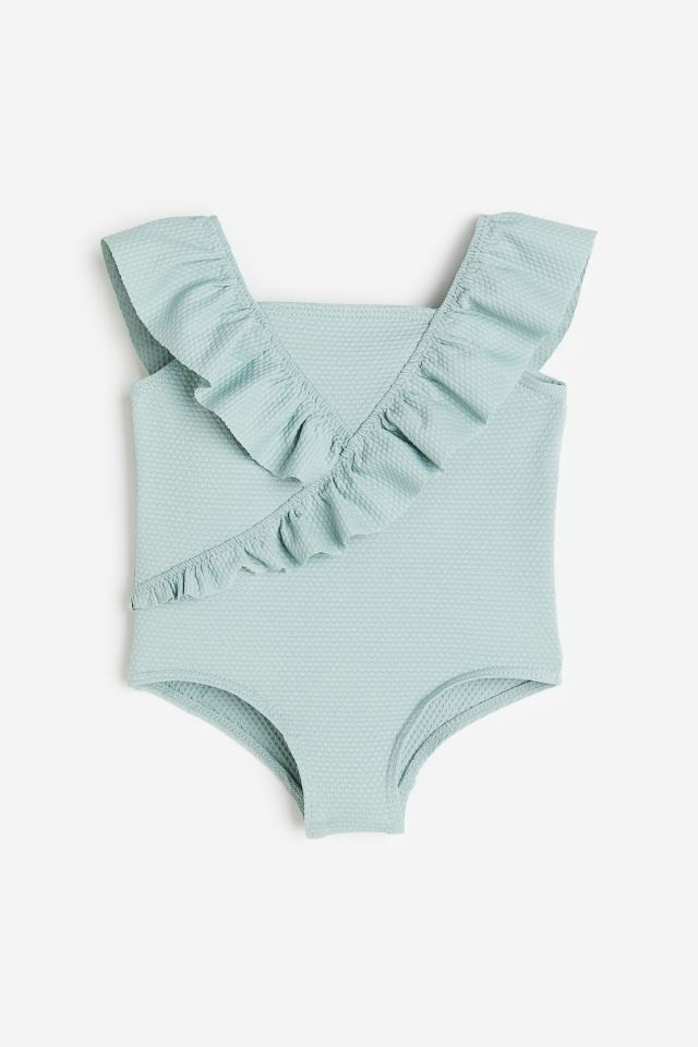 Bộ bơi liền HM tổ ong bèo vạt 3 màu hồng nhạt / mint / hồng đất size 6m - 4y