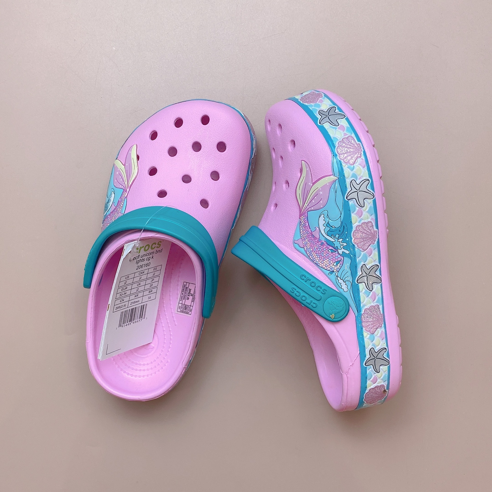 Sục Crocs màu hồng đuôi cá quai xanh BG