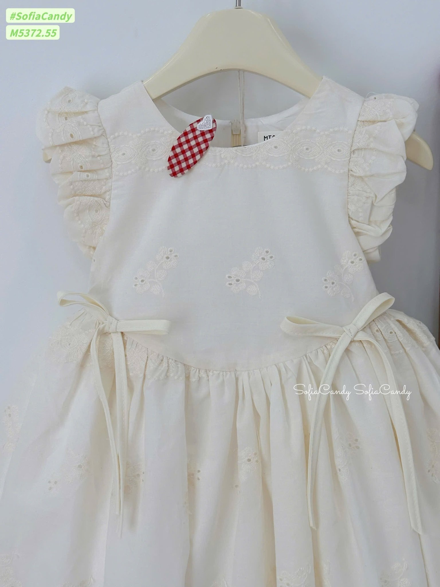 M5372 - Váy Mia Kids màu be đính nơ thêu hoa bé gái size 1-10y