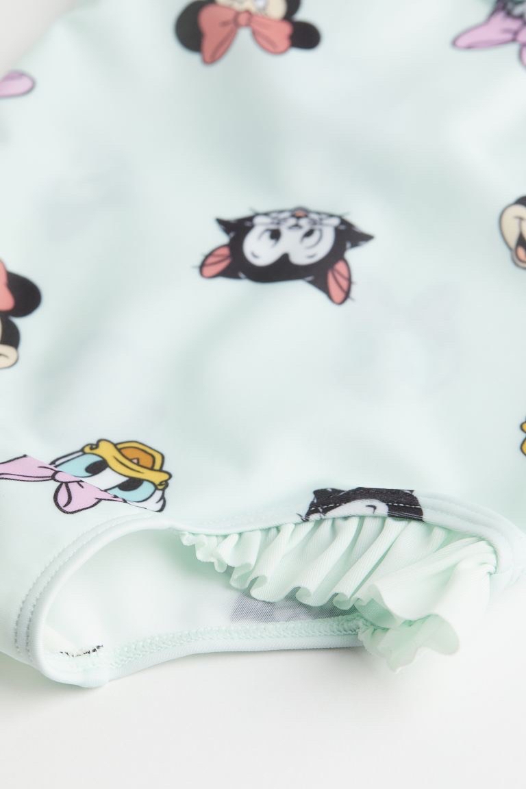 Bộ bơi HM màu xanh mint minnie in tràn BG size 3m - 4y