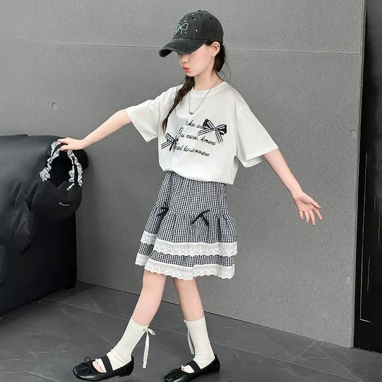 Set áo cotton màu trắng nơ + chân váy kẻ caro đen size 110 - 150