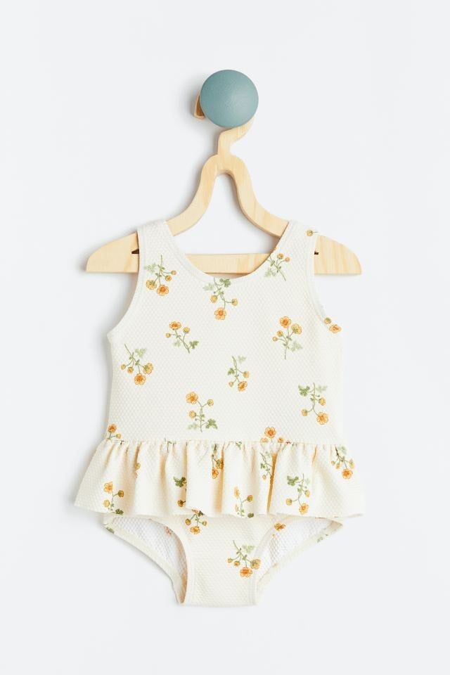 Bộ bơi liền HM màu kem hoa nhí vàng size 6m - 4y