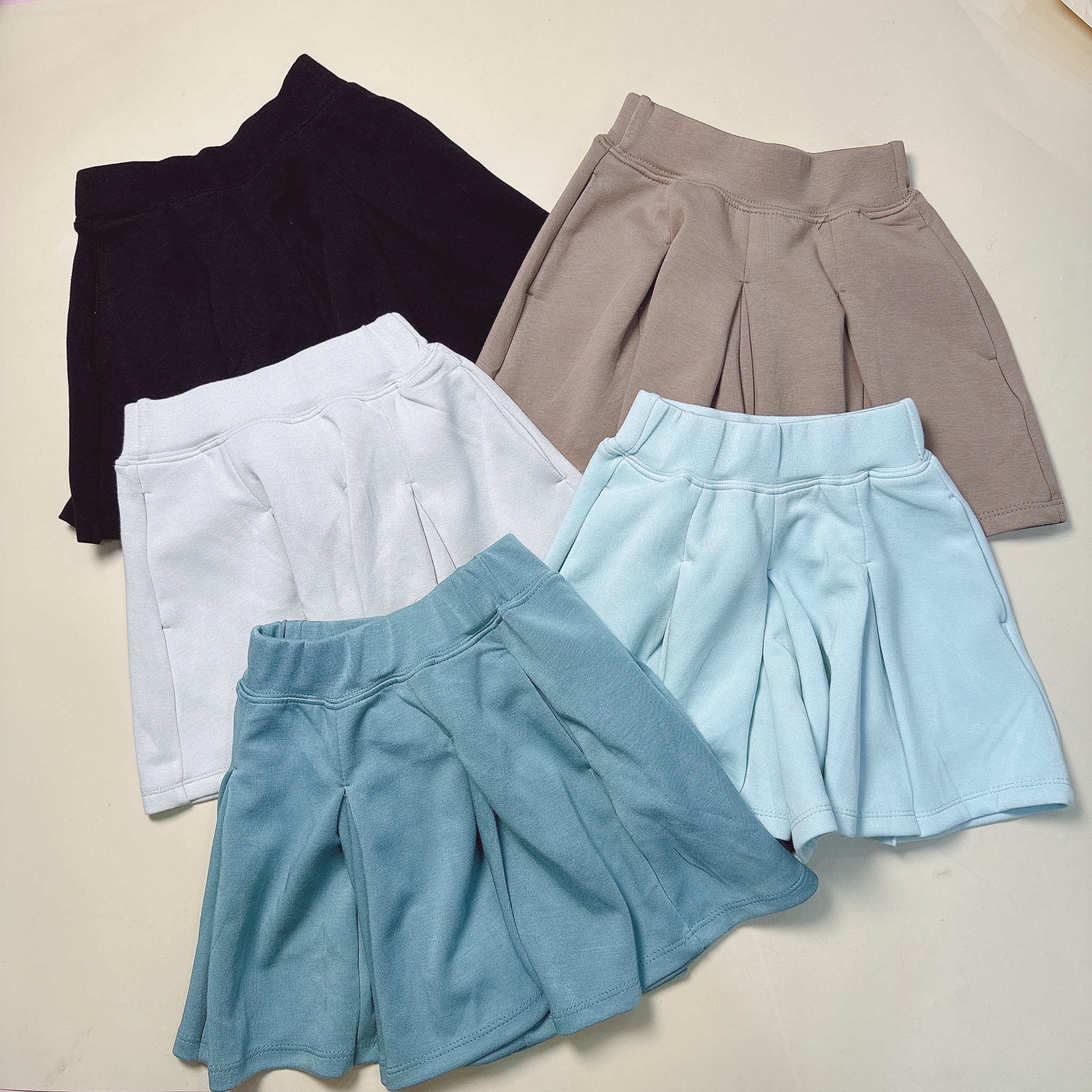 Quần váy xếp ly vải thun mềm nhiều màu cho bé gái size 110-160
