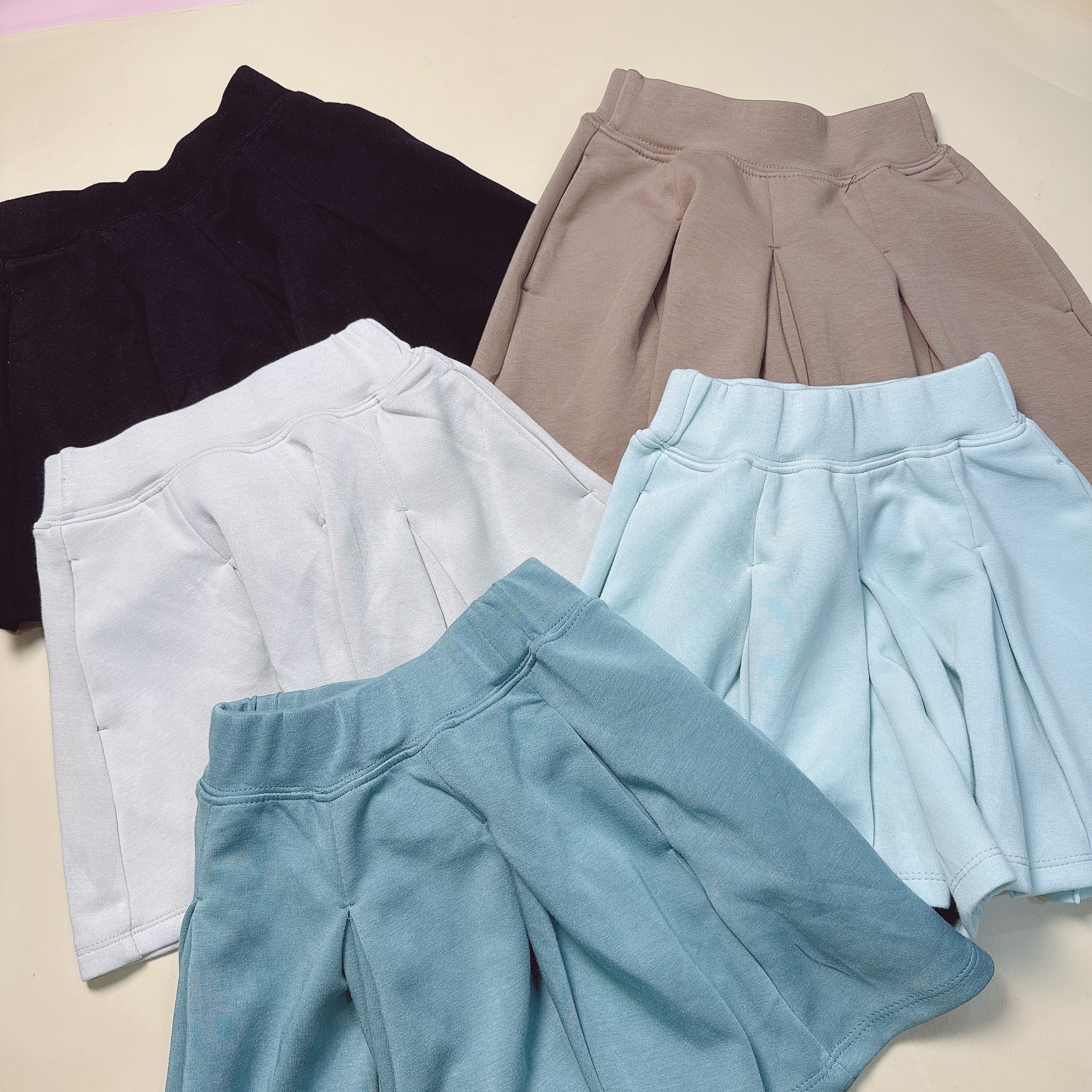 Quần váy xếp ly vải thun mềm nhiều màu cho bé gái size 110-160
