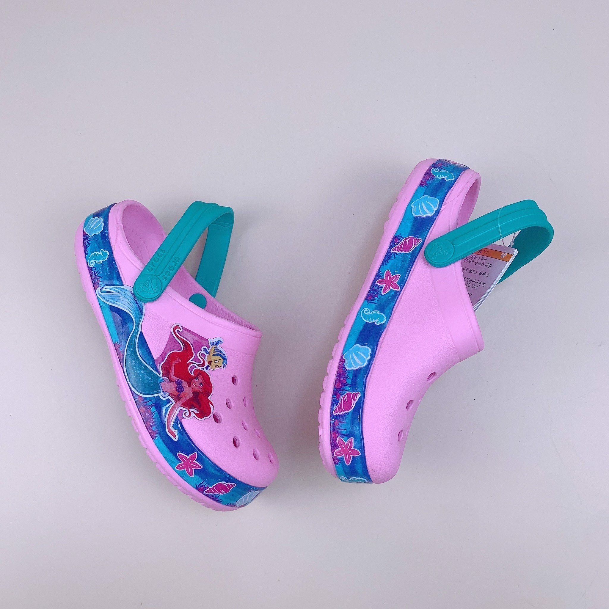 Sục Crocs tiên cá hồng viền xanh BG