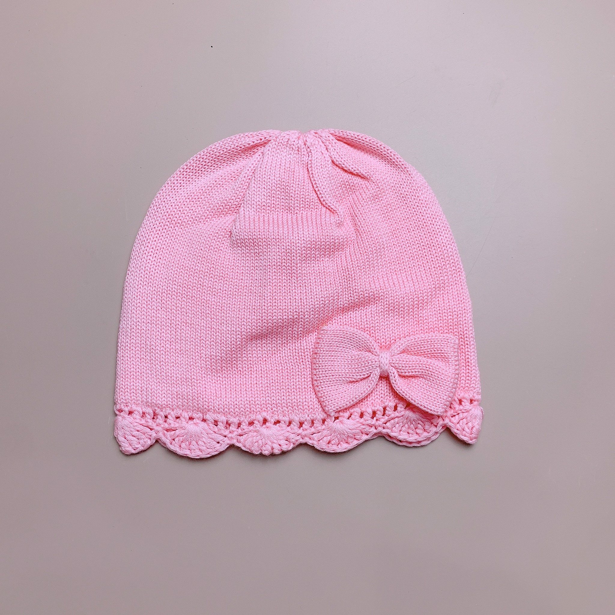 Mũ len lót cotton Ruhikids tròn đính nơ hồng/đỏ