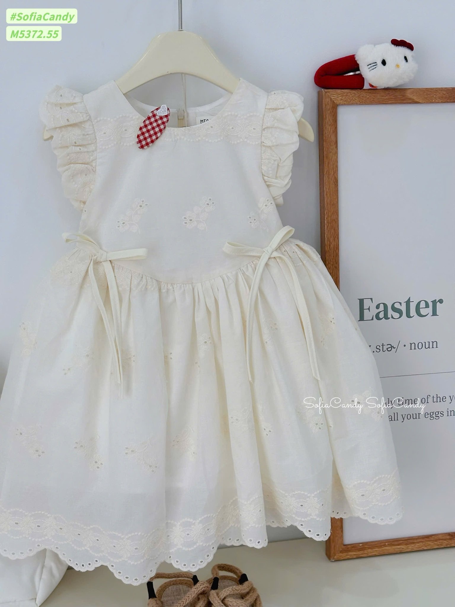 M5372 - Váy Mia Kids màu be đính nơ thêu hoa bé gái size 1-10y