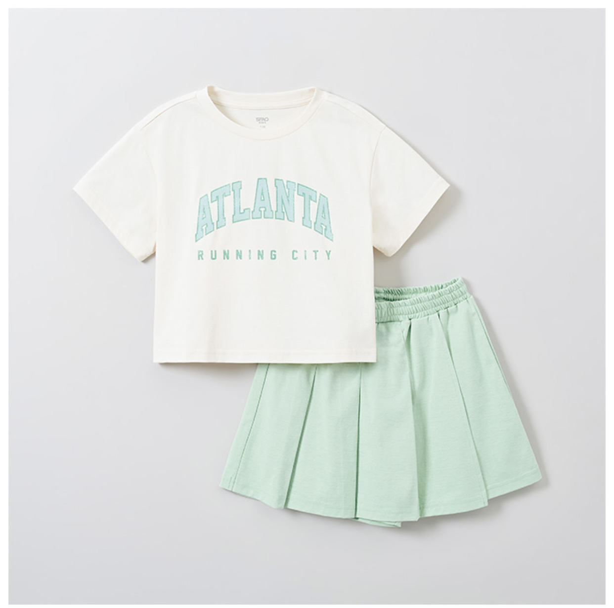 Bộ thể thao Spao Atlanta áo thun + quần giả váy xếp ly 2 màu BG size 110-160