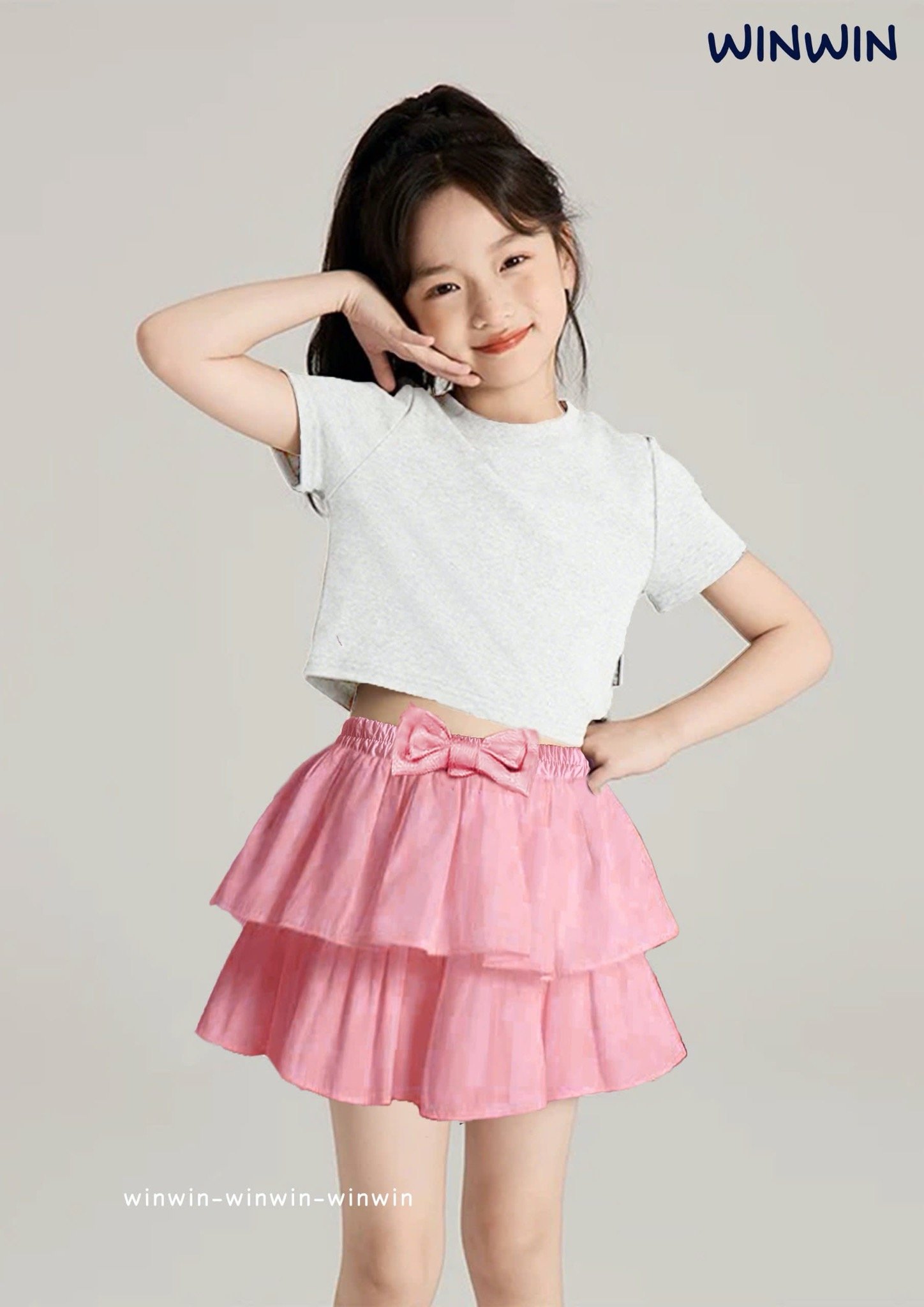 Chân váy thô liền quần Win Win nhún 2 tầng cạp đính nơ size 3 - 14y
