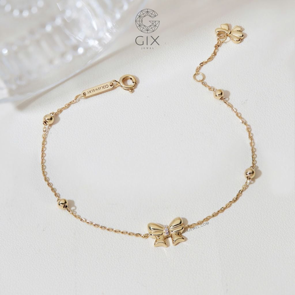  Vòng tay vàng trắng 18k bi tròn kiểu dây xích mảnh hot trend gắn charm vàng hình nơ xinh 