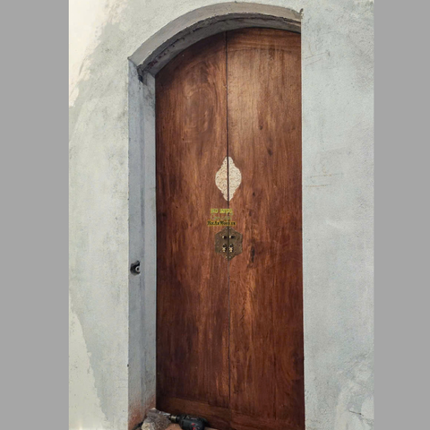 Cửa gỗ vòm điêu khắc