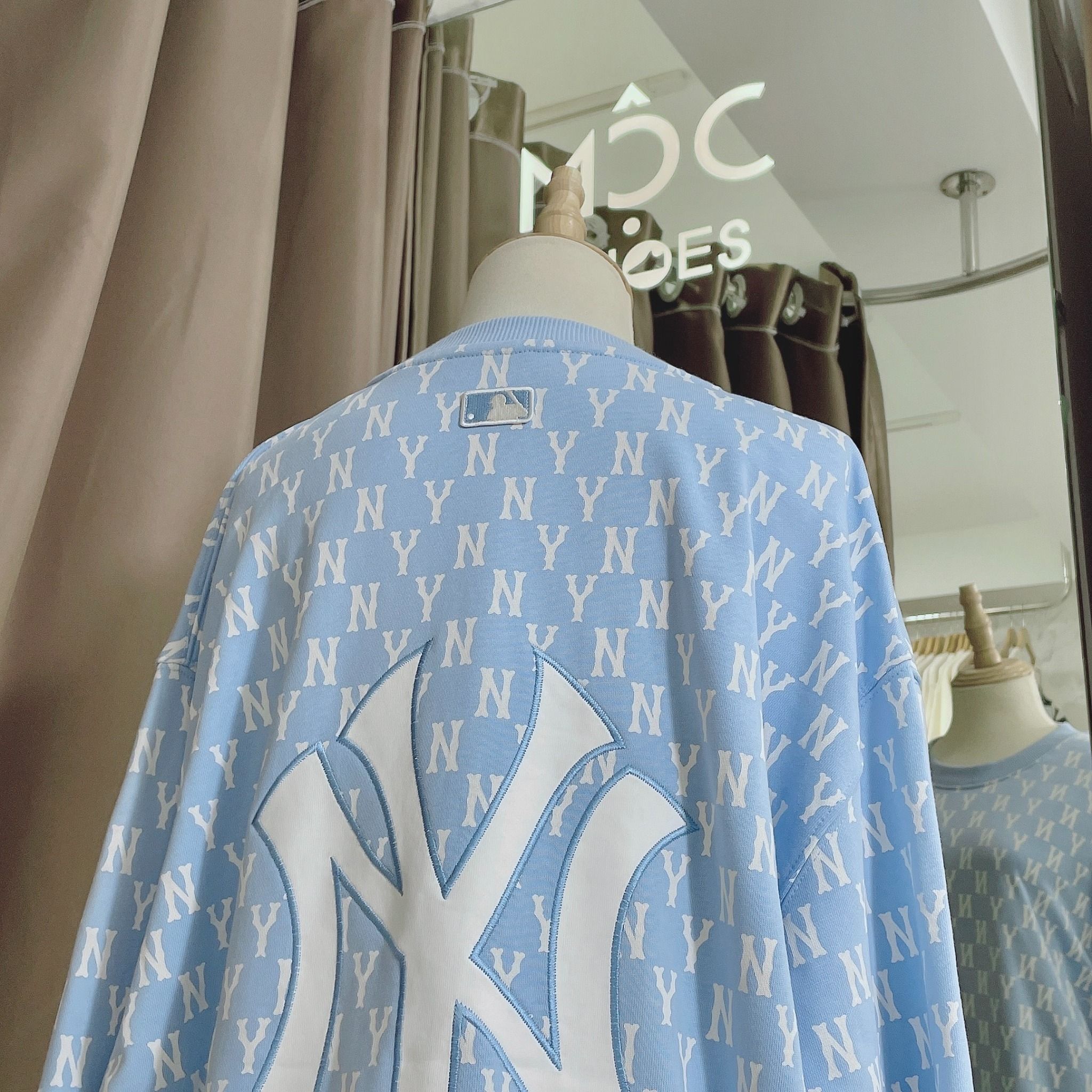  1662 - HÀNG CHÍNH HÃNG - ÁO SWEATER  MLB MONOGRAM ALLOVER OVERFIT SWEATSHIRT NEW YORK *NY BABYBLUE* - CODE: 3AMTM0221-50BLL 