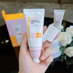 Set kem chống nắng CNP 50ml+31ml nâng tone cho da dầu