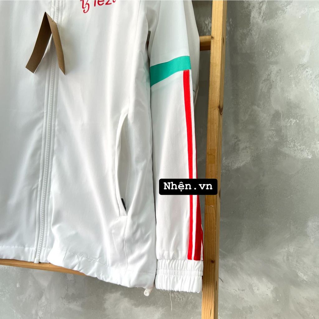 ÁO KHOÁC GIÓ MANCHESTER UNITED 2023/24 TRẮNG PHỐI SỌC XANH NGỌC SỌC ĐỎ