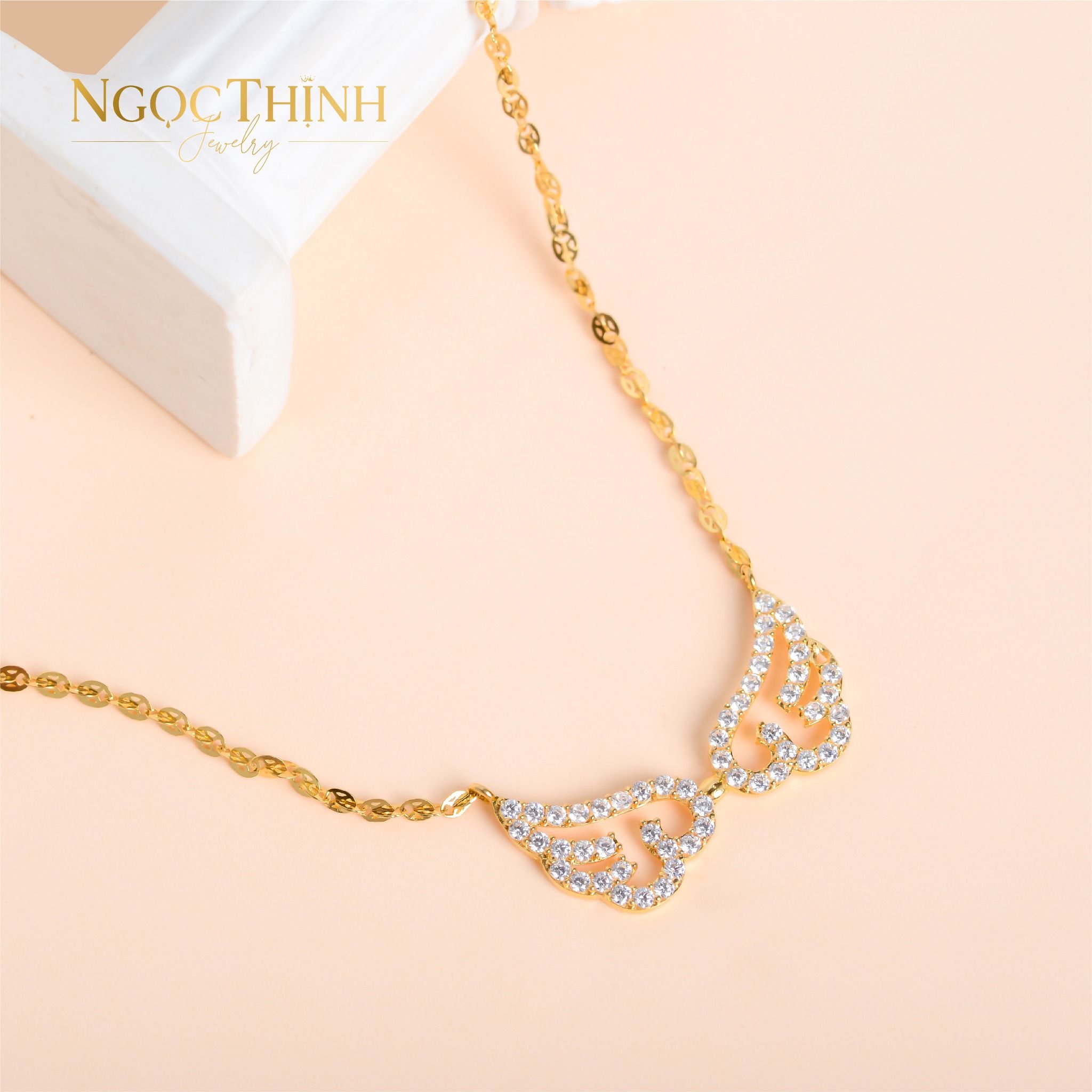 Dây chuyền liền mặt đôi cánh